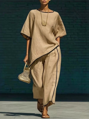 Khaki linen two-piece set with contrast trim, cropped pants and short sleeves.