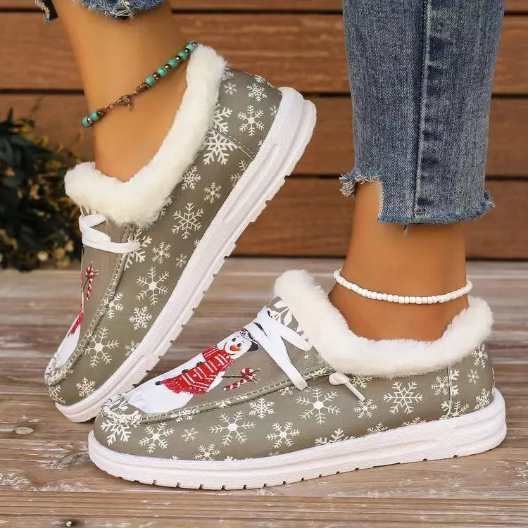 Snowman print faux-fur lined loafers in khaki with white snowflakes and trim.
