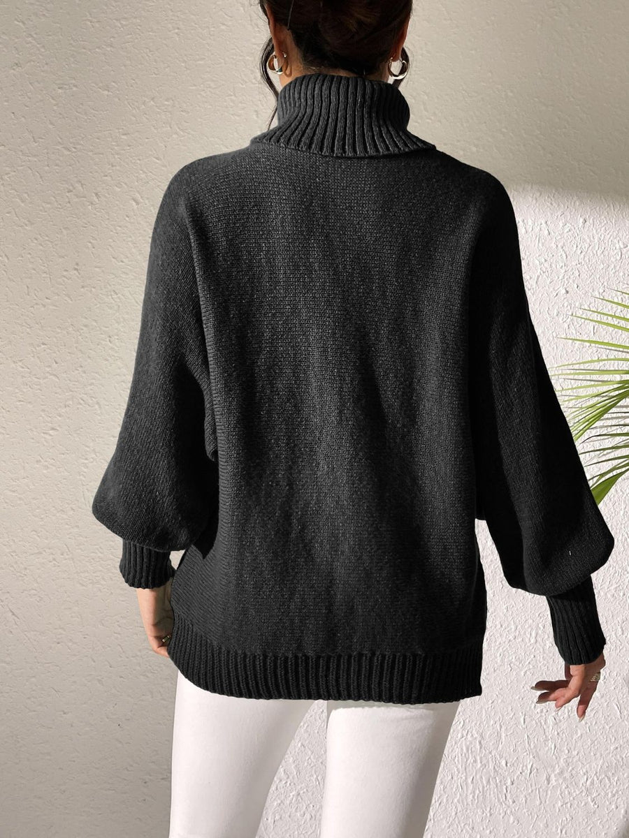 Black turtleneck sweater with balloon sleeves and ribbed cuffs and hem