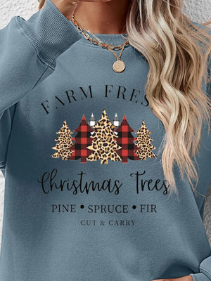 Crewneck sweatshirt in Misty Blue with Christmas trees graphic featuring plaid and leopard print.