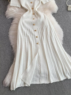 White ribbed knit midi dress with gold button detail and front slit