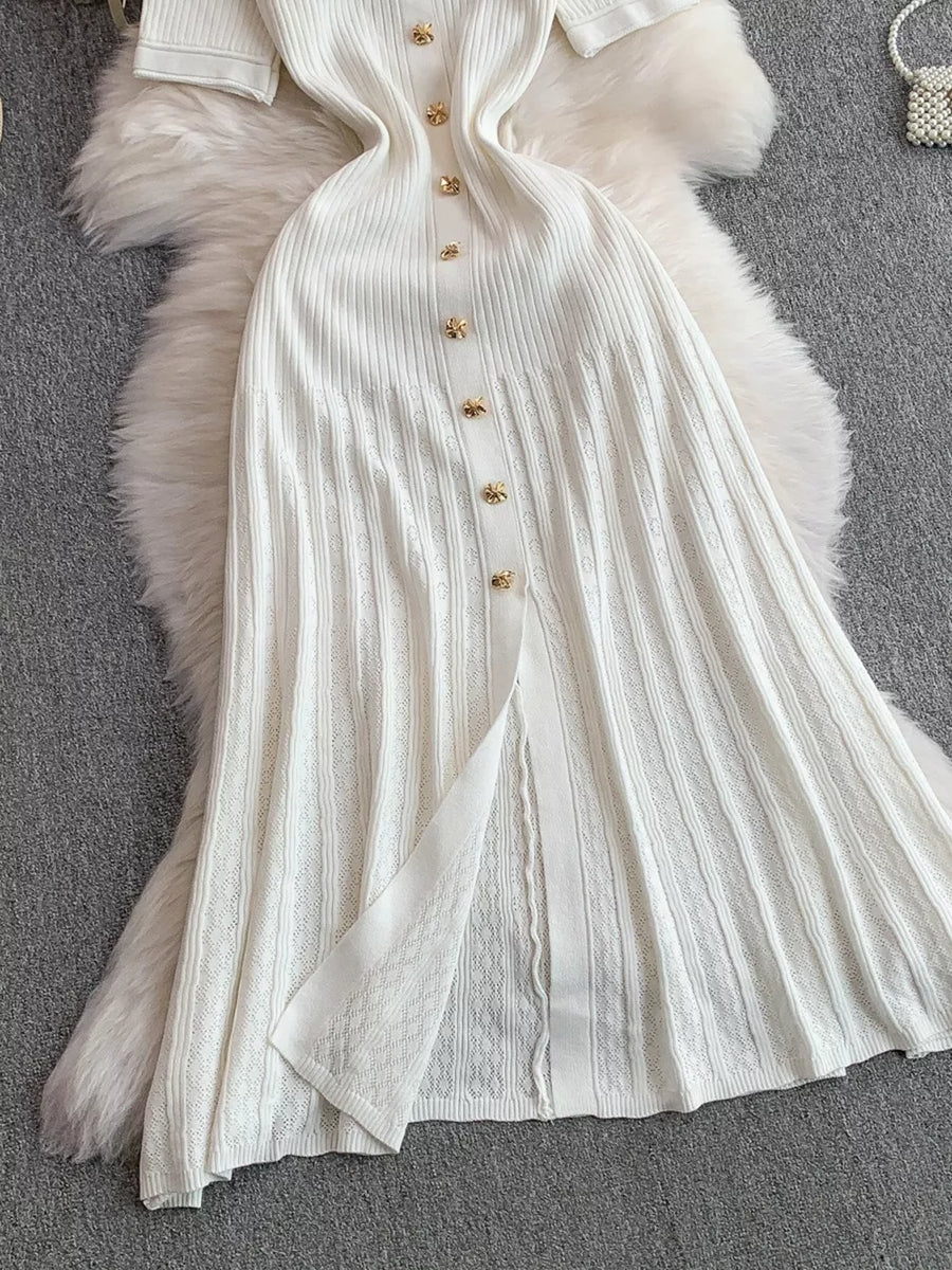 White ribbed knit midi dress with gold button detail and front slit