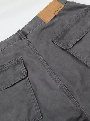 Relaxed fit grey cotton cargo capris with button closure and multiple pockets.