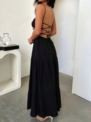 Black backless maxi dress with crisscross detail and tiered skirt