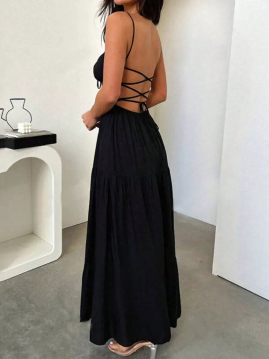 Black backless maxi dress with crisscross detail and tiered skirt