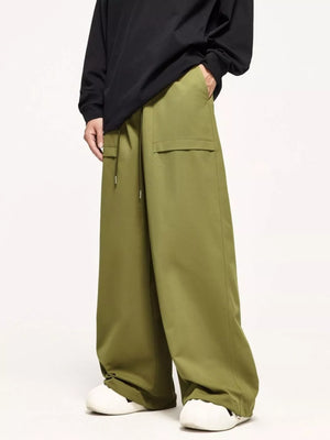 Relaxed fit cargo pants in yellow-green with drawstring and large side pockets.