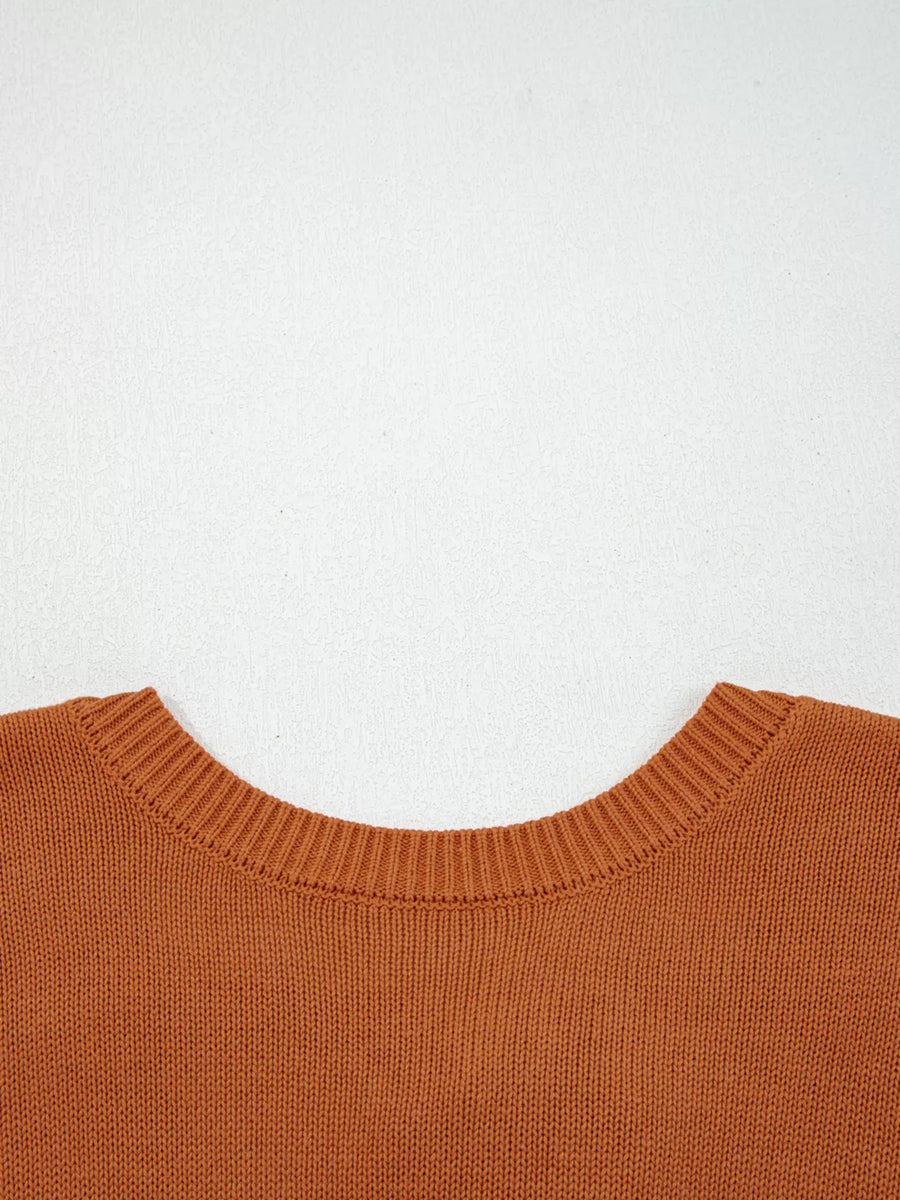 Caramel acrylic blend sweater with ribbed crew neck and drop shoulders.