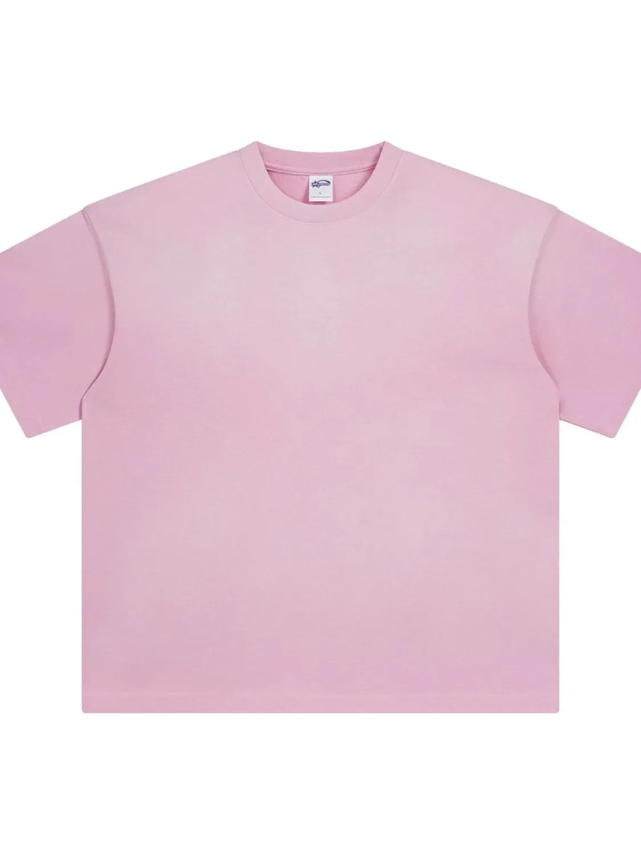 Oversized washed tee in Blush Pink with relaxed fit and crew neck.