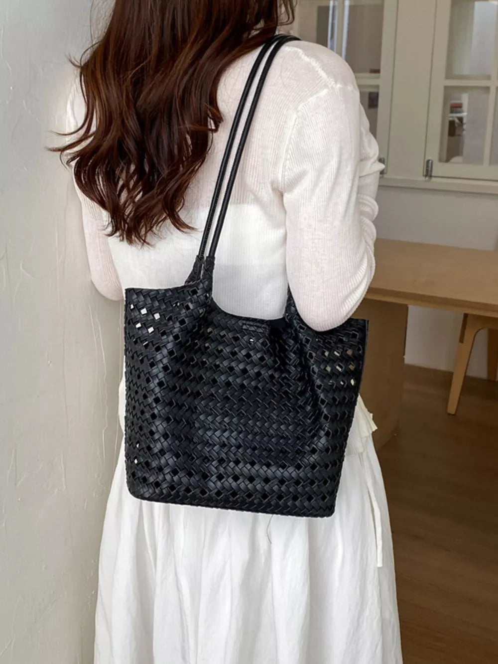 shoulder bag in black with woven and woven