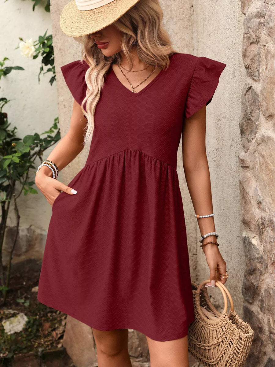 Burgundy a-line dress with ruffled sleeves and v-neck, textured fabric, above knee length.