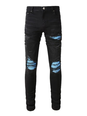 Black distressed denim jeans with azure underlay detail.