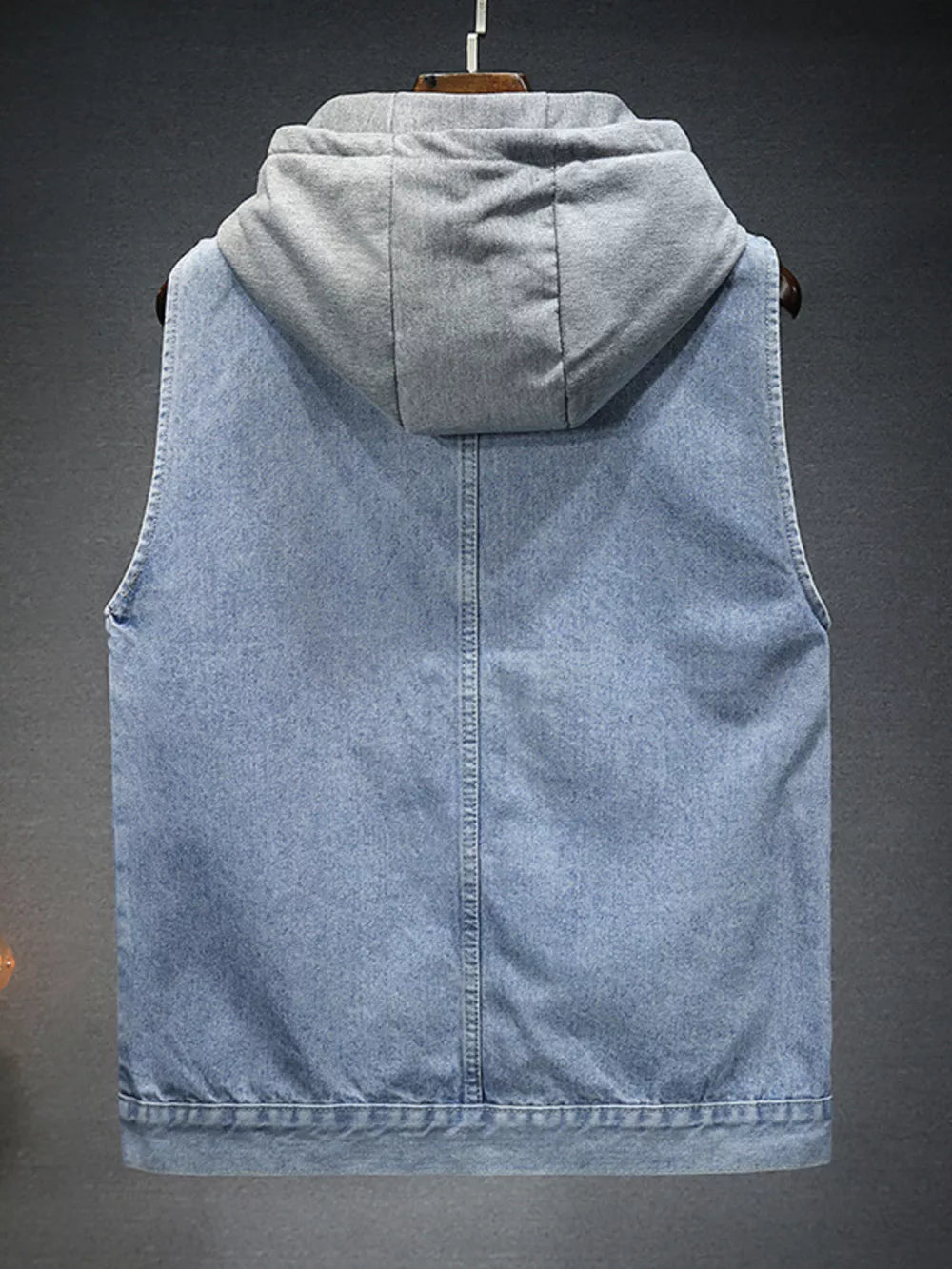 Light wash denim vest with grey fleece hood, button-down style, casual men's outerwear.