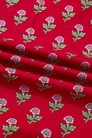 Red floral mini dress fabric with pink flowers and green leaves.