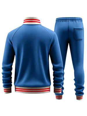 French blue tracksuit with red and white striped collar and cuffs.