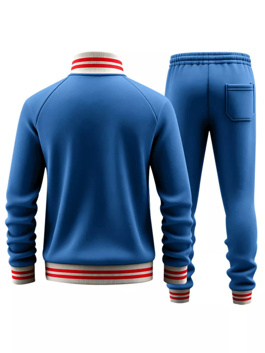 French blue tracksuit with red and white striped collar and cuffs.