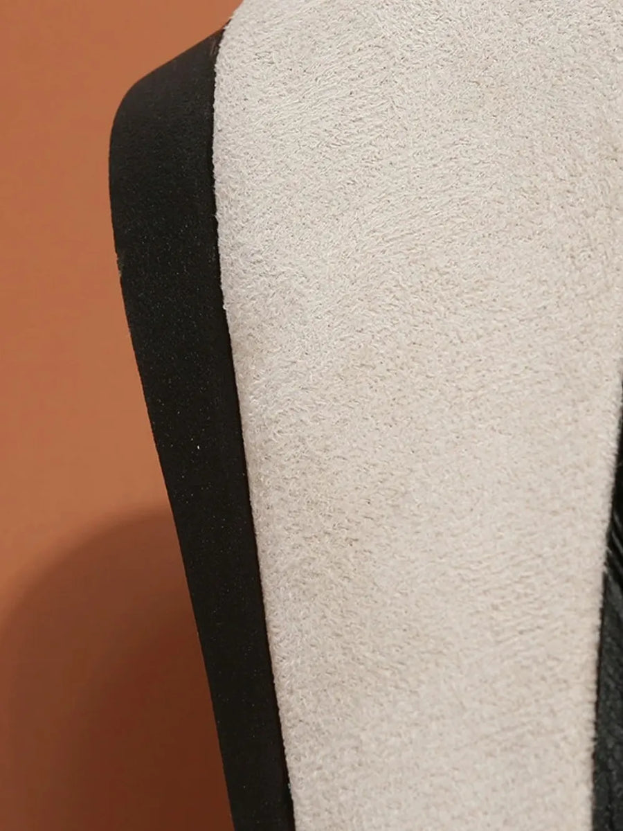 Beige suede ballet flats with black trim detail.