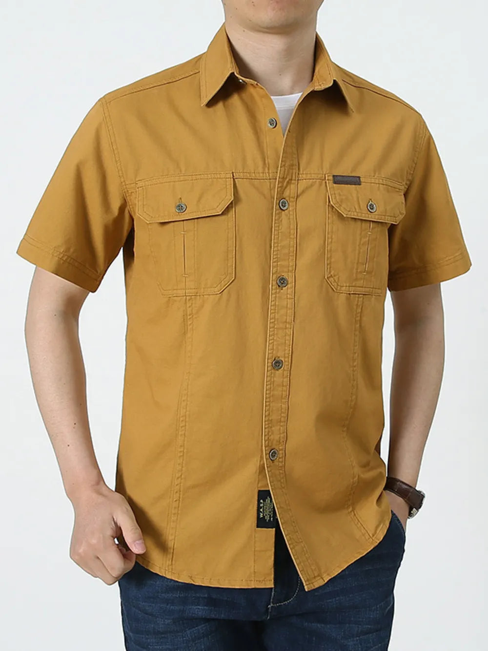 Men's casual short sleeve shirt in ginger yellow cotton with two chest pockets and button-up front.
