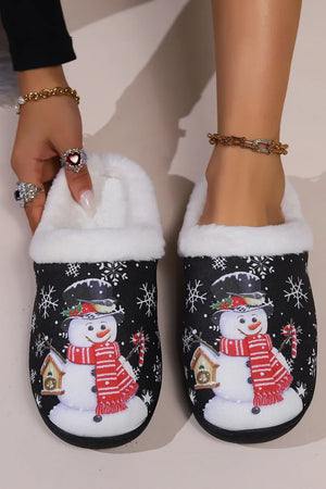 Black faux fur lined slippers with snowman and snowflake print.