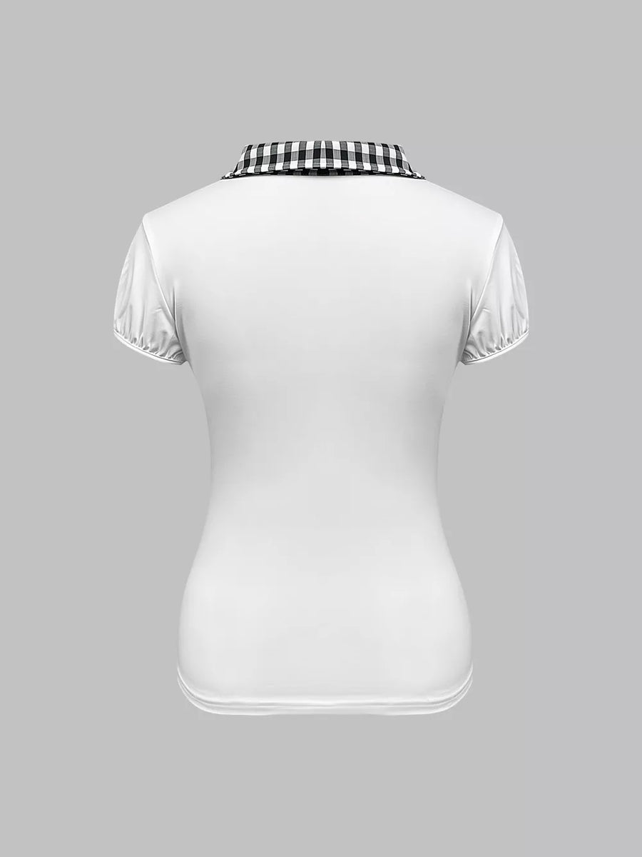 White maternity shirt with black gingham collar and puffed short sleeves