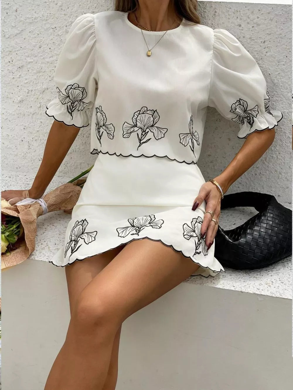 White embroidered floral two-piece set with puff sleeves and scallop trim.