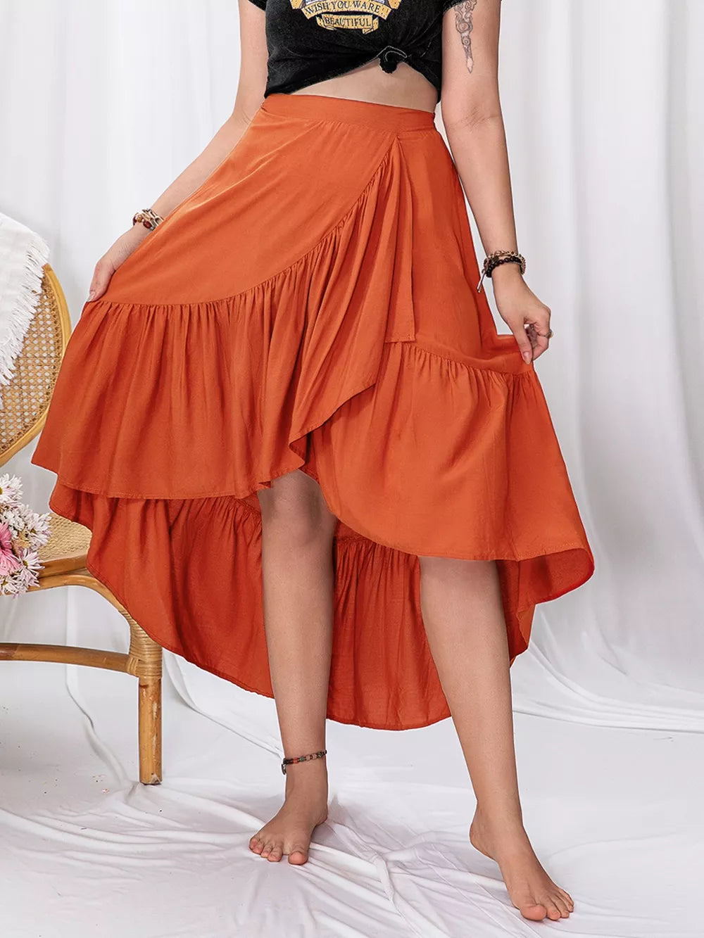 Orange ruched high-low wrap skirt with ruffle trim for curvy women