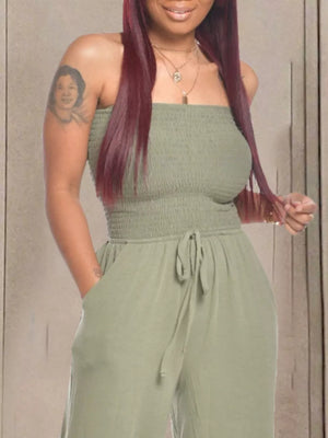 Olive green smocked strapless jumpsuit with drawstring waist and wide legs