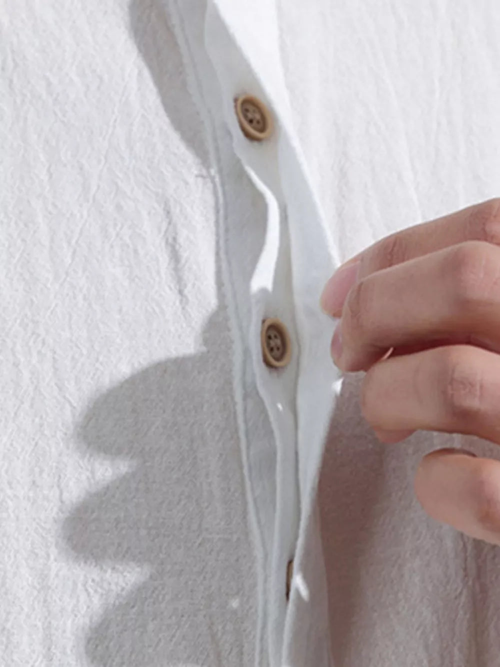 White cotton textured band collar shirt with button detail