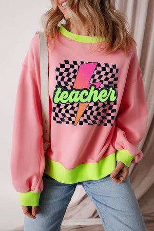 Pink graphic sweatshirt with neon trim and a lightning bolt teacher design.