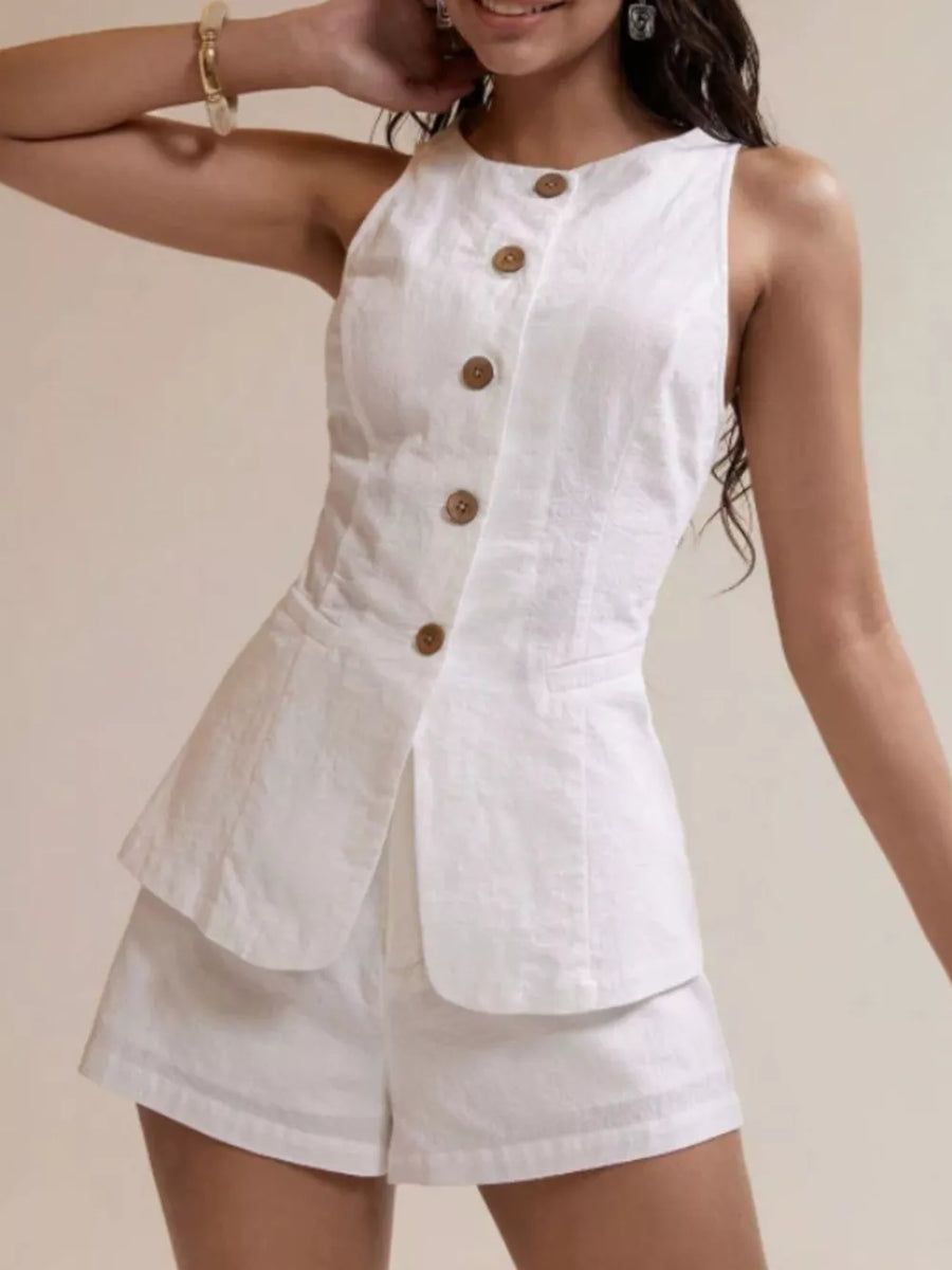 White cotton two-piece summer set with decorative buttons and shorts.