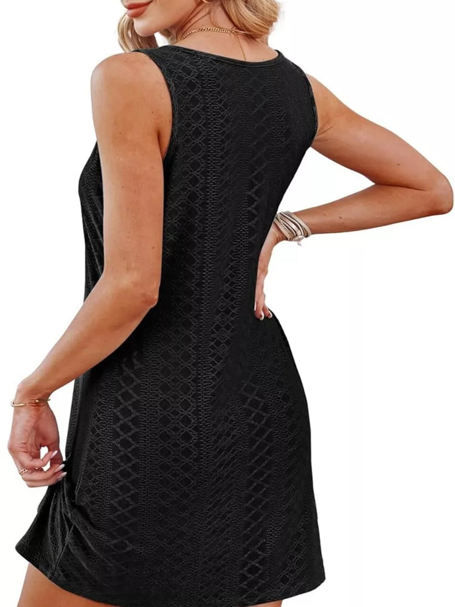 Black eyelet tank dress with twisted hem detail and subtle diamond pattern.