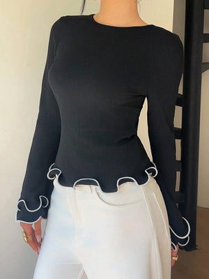 Black ribbed long sleeve t-shirt with ruffled hem and cuffs.