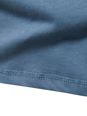 Henley knit long sleeve tee in Peacock Blue with double-stitched hem detail.