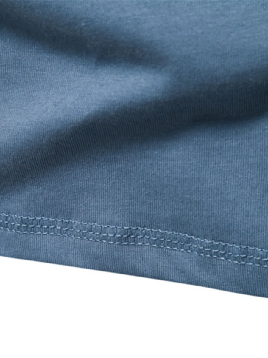Henley knit long sleeve tee in Peacock Blue with double-stitched hem detail.
