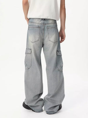 Relaxed fit light wash denim cargo jeans with vintage appeal and ample pocket detailing.