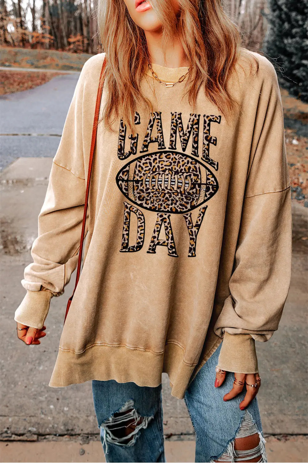 Khaki leopard print football graphic sweatshirt with "GAME DAY" text.