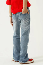 Seam detail flare jeans in medium wash denim with frayed hems.