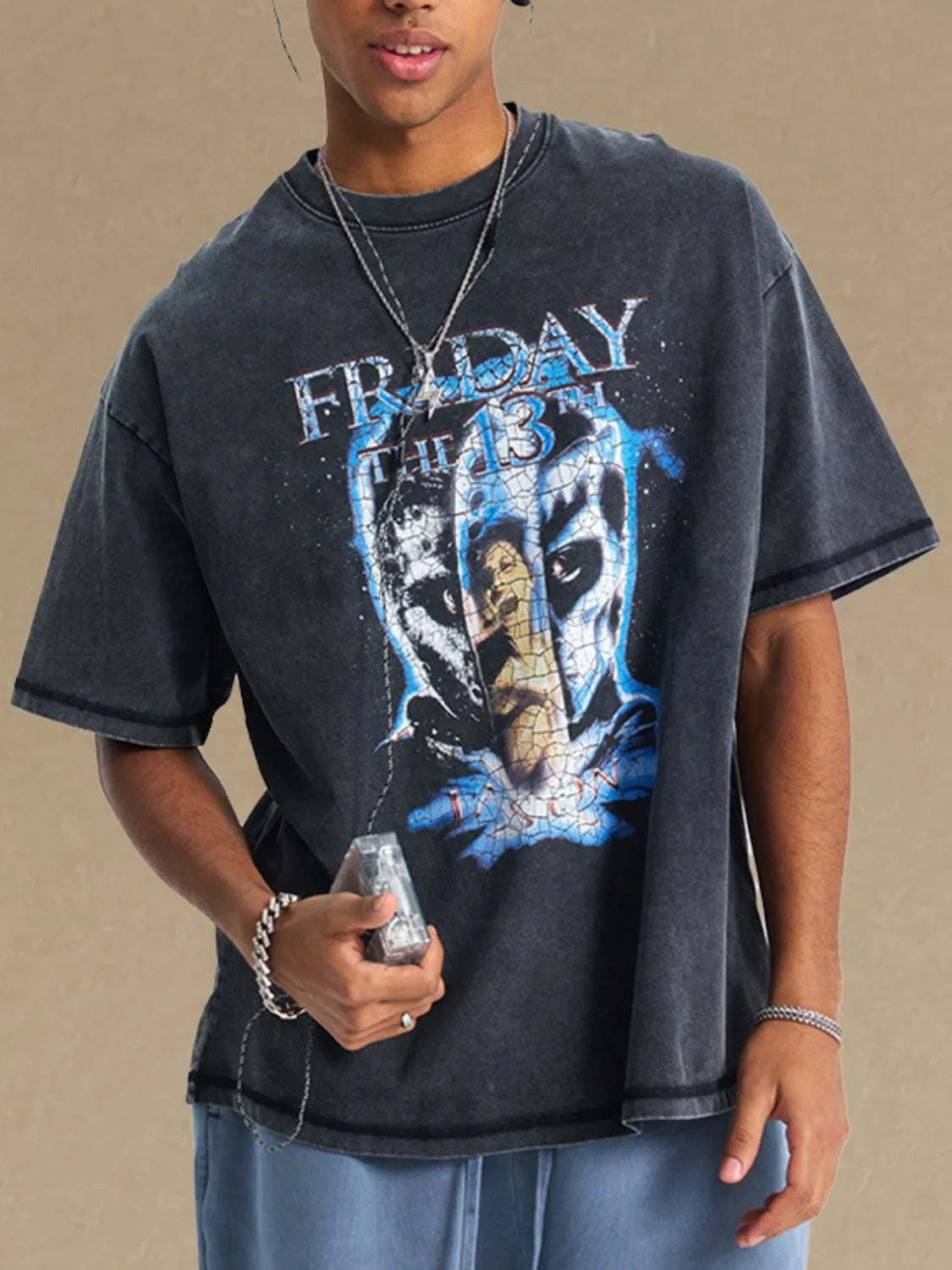 Black vintage wash graphic tee with Friday the 13th print and distressed details.