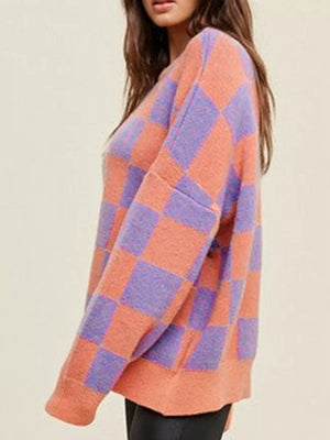 Chic checkerboard knit sweater in multicolor with crew neck and long sleeves.