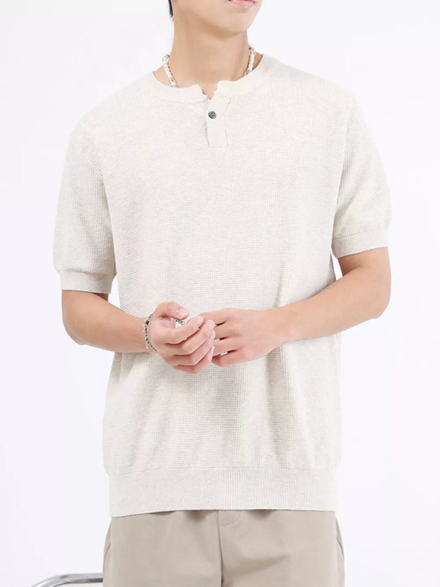 Men's short sleeve knit henley t-shirt in off-white with waffle texture and button placket.