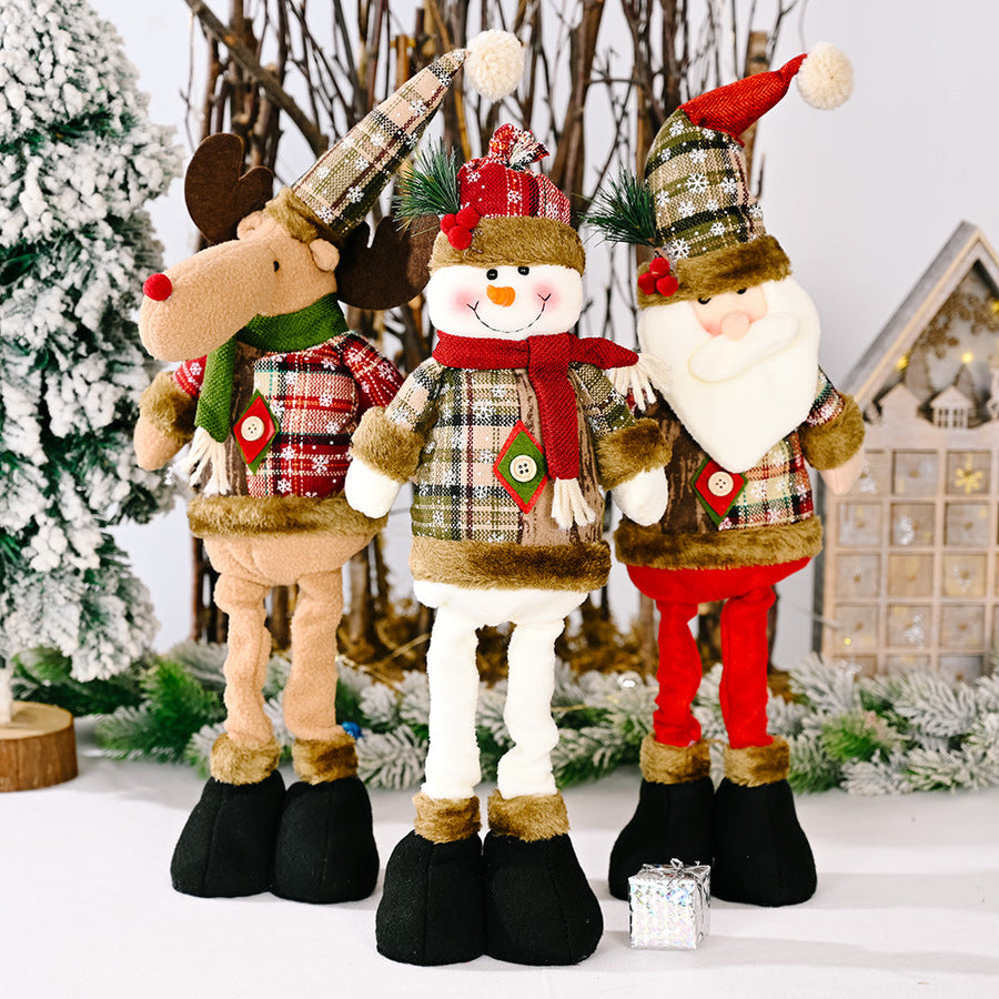 Festive Plaid Character Trio: Santa, Snowman, and Reindeer plush decorations with plaid outfits and fuzzy trim.