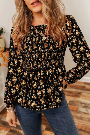 Black floral long-sleeve blouse with smocked waist and peplum hem