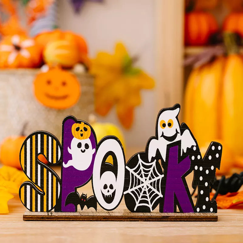 decorative ornament in yellow with striped and Halloween motifs