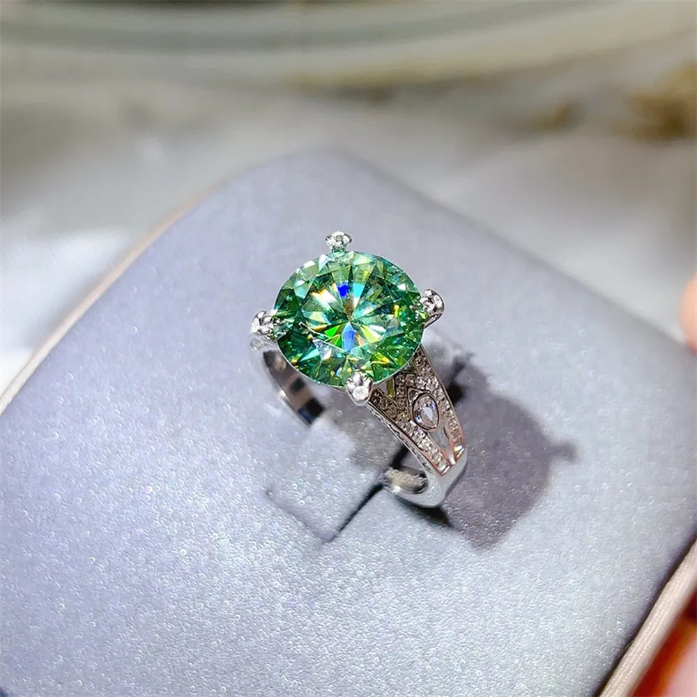 ring in emerald green featuring large center stone and ring fit