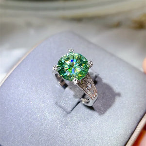 ring in emerald green featuring large center stone and ring fit