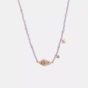 gold necklace featuring beaded and star-moon