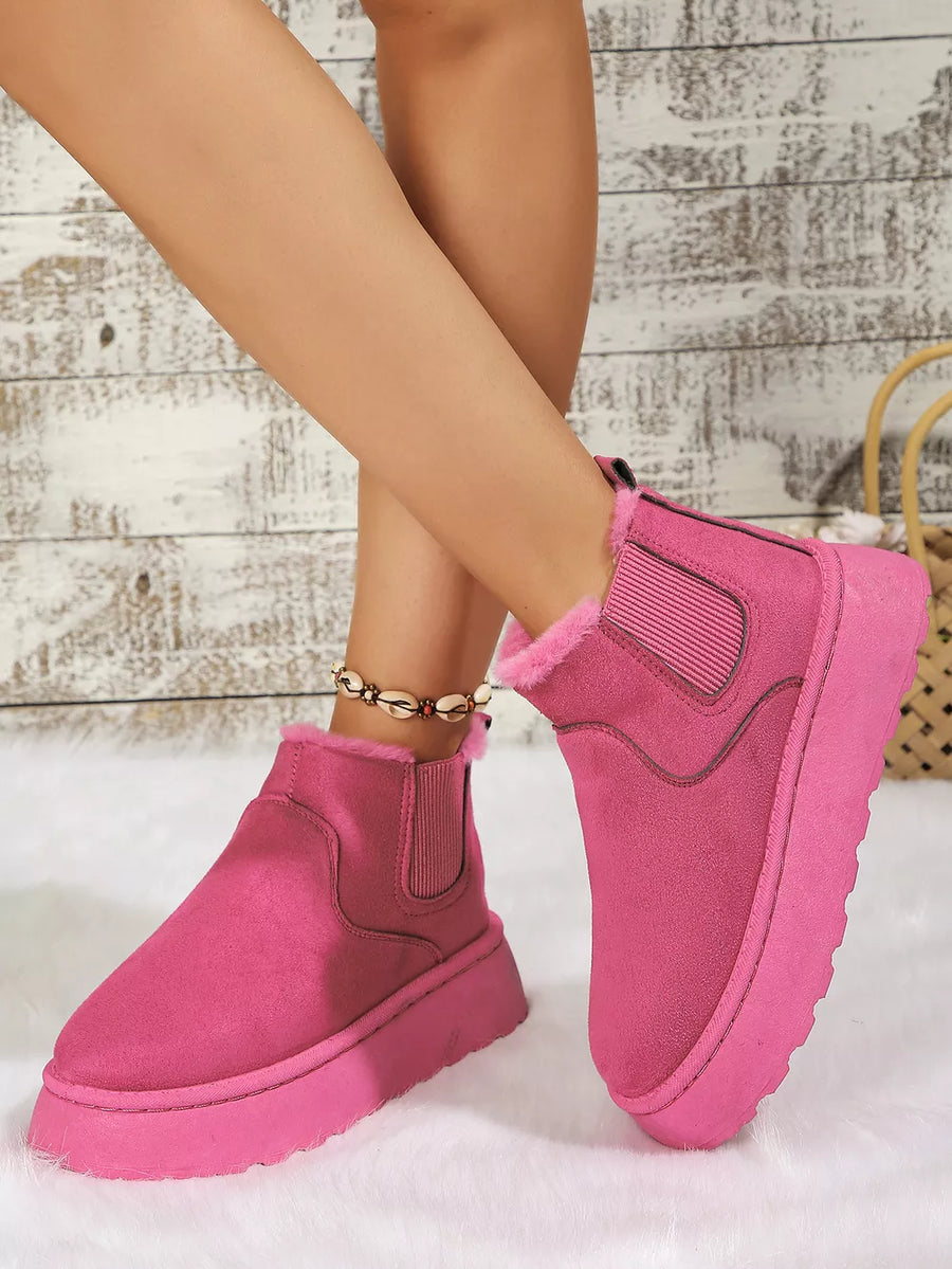 Hot Pink suede round toe platform ankle boots with faux fur lining and elastic side panels.