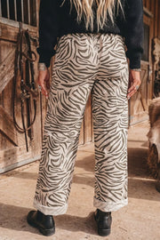 dark olive green wide-leg pants featuring drawstring and zebra-print