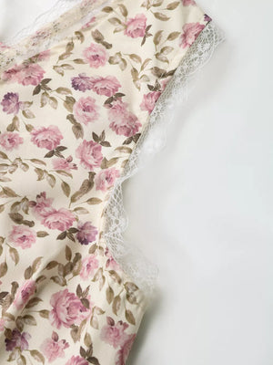 Charming floral lace tie mini dress with pink roses and white lace trim.