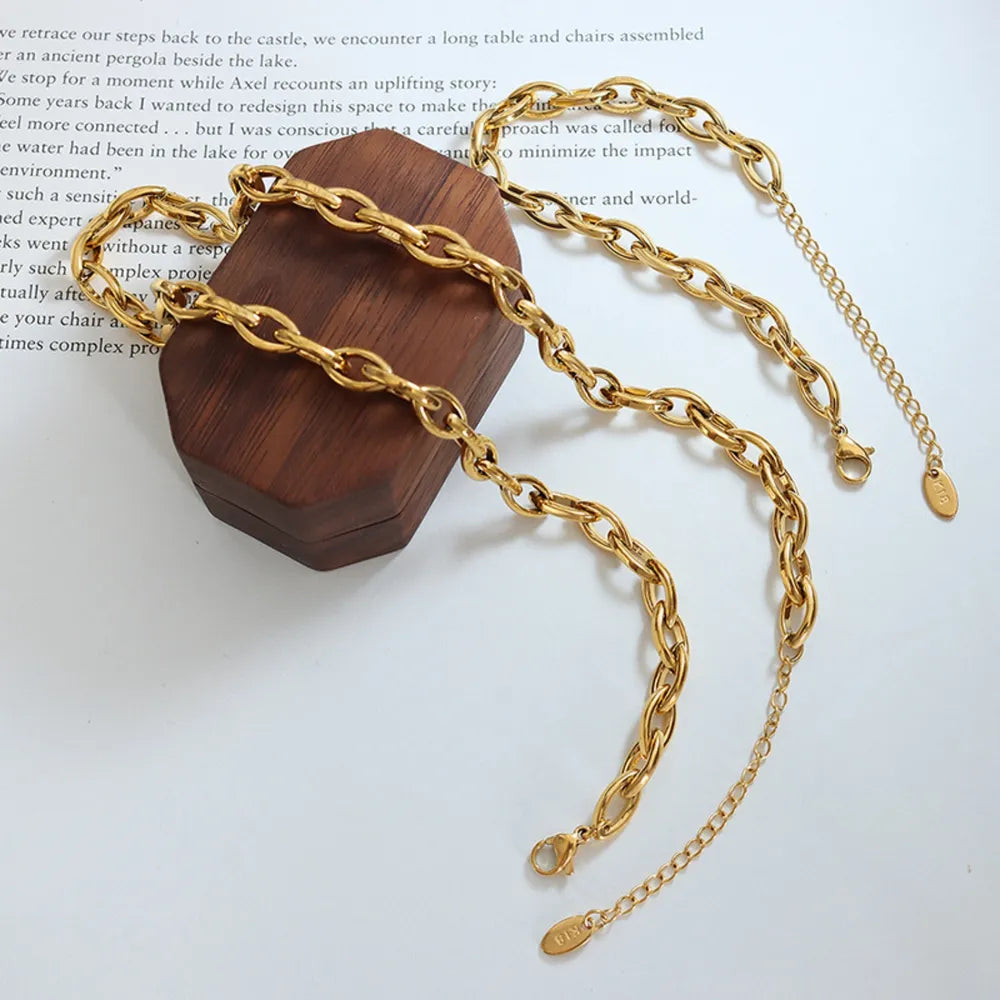 Gold chain link bracelet with adjustable clasp and extender chain