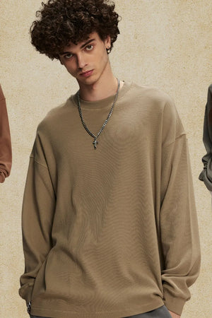 Oversized drop shoulder crewneck sweatshirt in khaki with crew neckline and long sleeves.